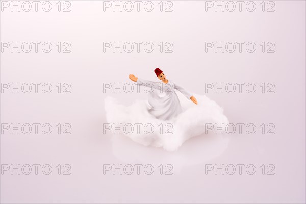 Sufi Dervis on a Cloud on a white background