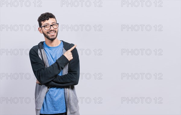 Smiling people pointing a banner to the side