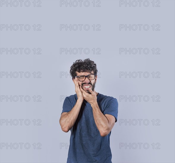 Attractive boy with toothache