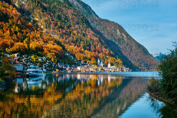 Austrian tourist destination Hallstatt village on Hallstatter See lake lake in Austrian alps with tourist boat