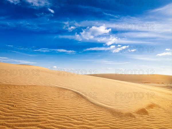 White sand dunes in desert on sunrise