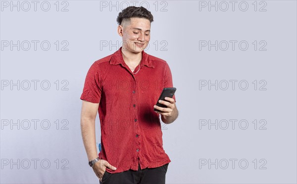 Handsome guy happy with his cell phone