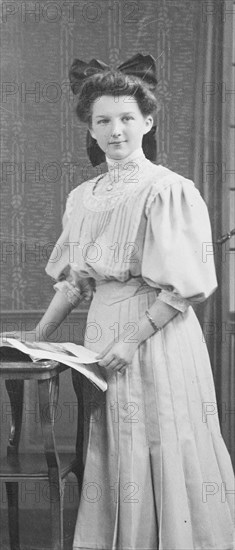 Elegant Young Woman with a Book