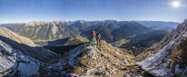 Two female hikers on a summit