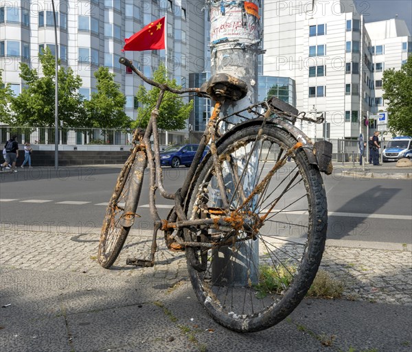 Old and rusty bicycle parked at the roadside