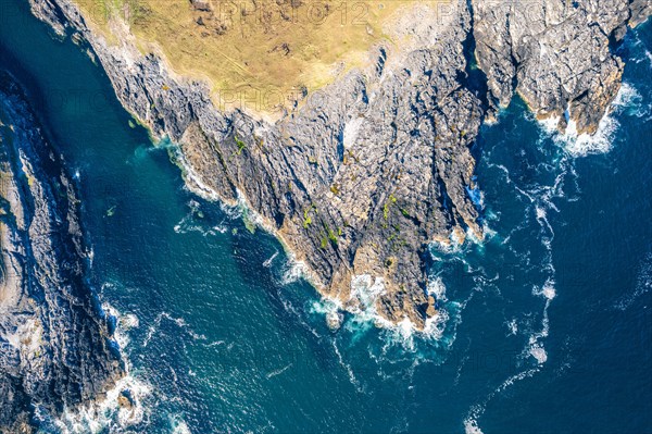 Top Down view over Geodha Smoo and Smoo Cave Cliffs from a drone