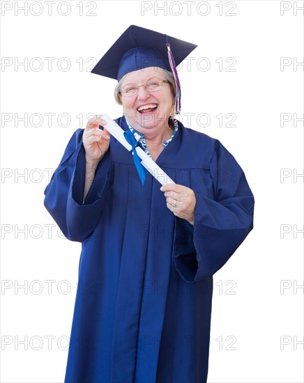 Happy senior adult woman graduate in cap and gown holding diploma isolated on a white background