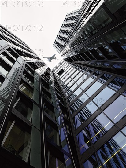 Aeroplane over two skyscrapers