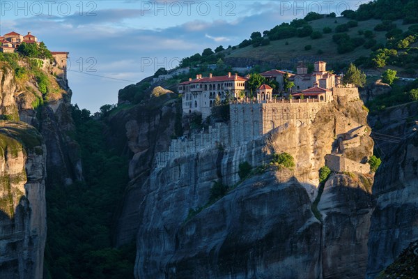 Monastery of Varlaam monastery and Great Meteoron Monastery in famous greek tourist destination Meteora in Greece on sunrise