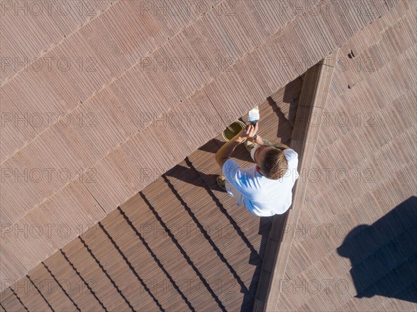 Professional painter using A brush to paint house facade