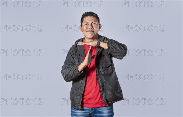 Man making time out gesture