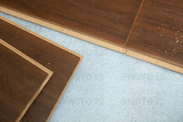 Newly installed brown laminate flooring abstract