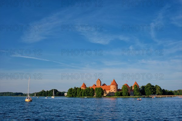 Trakai Island Castle in lake Galve with boats and yachts in summer day with beautiful sky