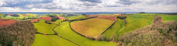Panorama over Fields and Meadows over English Village