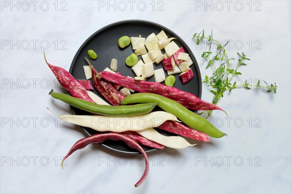 Various garden beans on plate