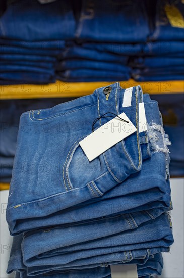 Close up of blue jeans on others with copy space