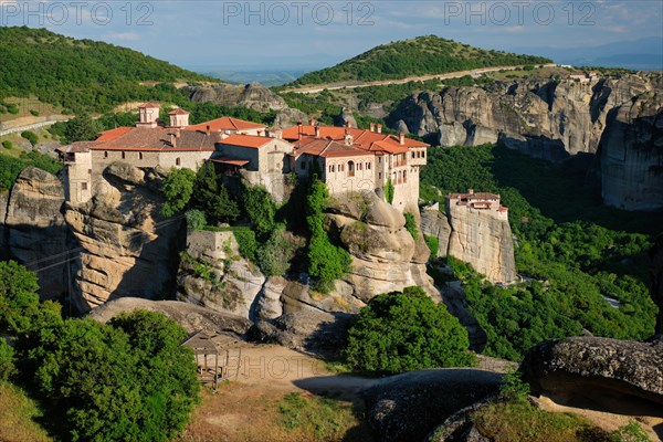 Monastery of Varlaam monastery and Monastery of Rousanou in famous greek tourist destination Meteora in Greece on sunset with scenic scenery landscape