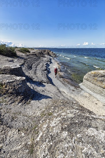 Hikers between limestone columns