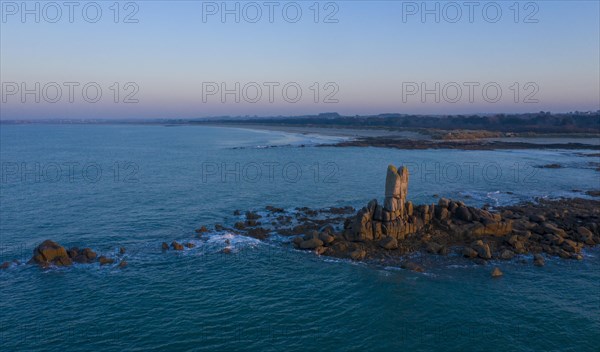 Aerial view of rock formations in the sea in front of the sandy beach Ker Emma