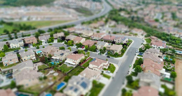 Aerial view of populated neigborhood of houses with tilt-shift blur