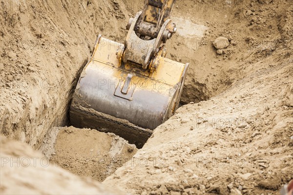 Working excavator tractor digging A trench