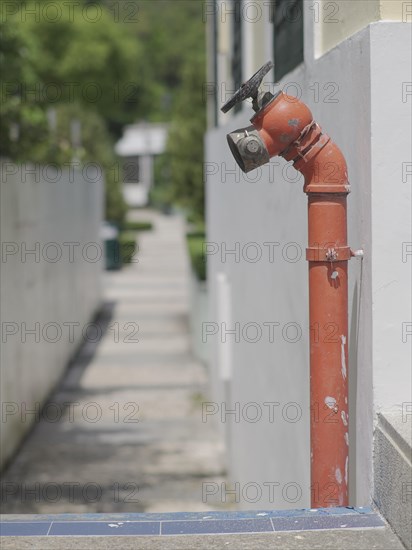 Red fire hydrant water pipe near the road