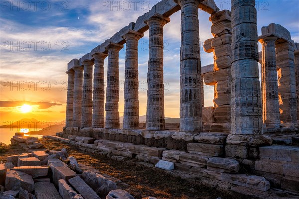 Cape Sounio sunset at Sounion with ruins of the iconic Poseidon temple