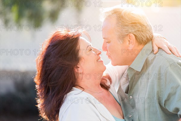 Happy middle aged couple enjoy A romantic slow dance outside