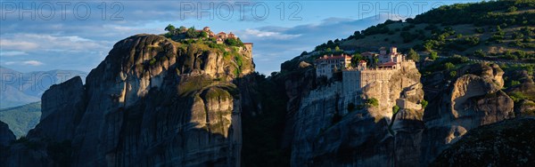 Monastery of Varlaam monastery and Great Meteoron Monastery in famous greek tourist destination Meteora in Greece on sunrise