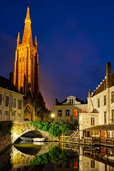 Church of Our Lady and canal illuminated in the night