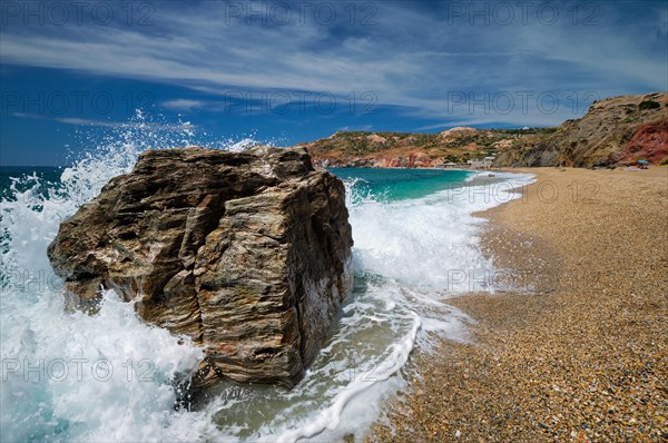 Rocks on Paleochori beach and waves of Aegean sea