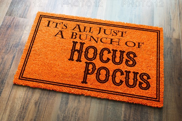 It's all A bunch of hocus pocus halloween orange welcome mat on wood floor background