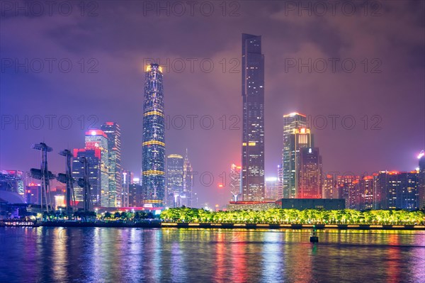 Guangzhou cityscape skyline over the Pearl River illuminated in the evening. Guangzhou