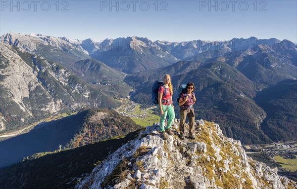 Two female hikers on a summit
