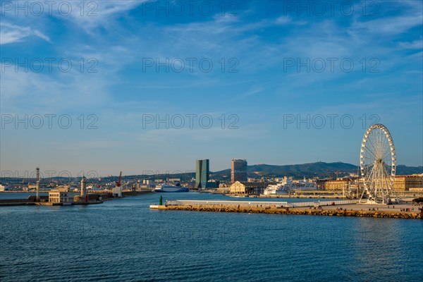 Grande Roue de Marseille Ferris wheel and Marseille cathedral and port of Marseille on sunset