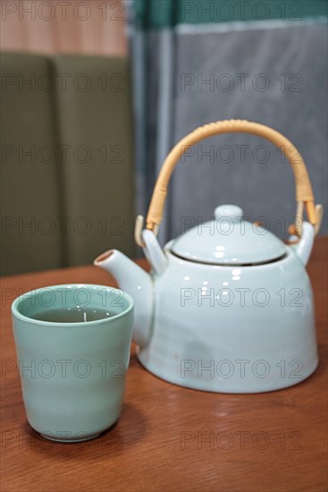 Teapot and cup in Cantonese restaurant