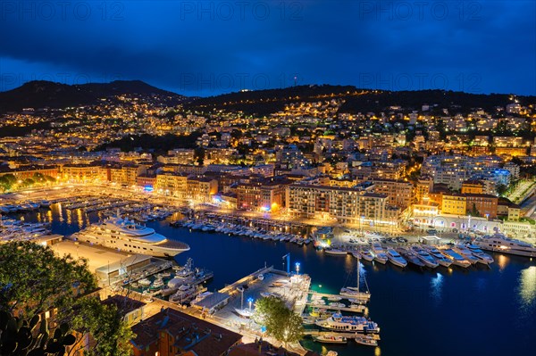 View of Old Port of Nice with luxury yacht boats from Castle Hill