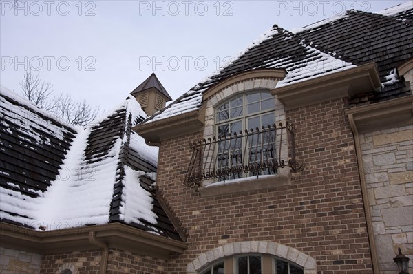 Majestic newly constructed home facade on a blustery day