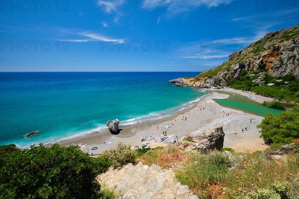 View of Preveli beach on Crete island with relaxing people and Mediterranean sea