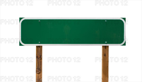 Blank green road sign with wooden posts isolated on a white background