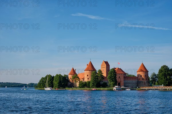Trakai Island Castle in lake Galve with boats and yachts in summer