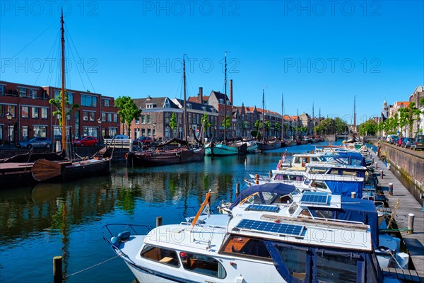 View of the harbour with moored boats in Delfshaven district