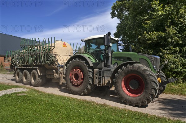 Large tractor with a slurry tanker