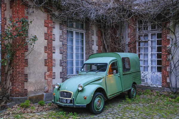 Vintage Citroen 2CV duck in a courtyard