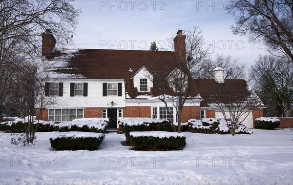 Majestic newly constructed home facade on a blustery day