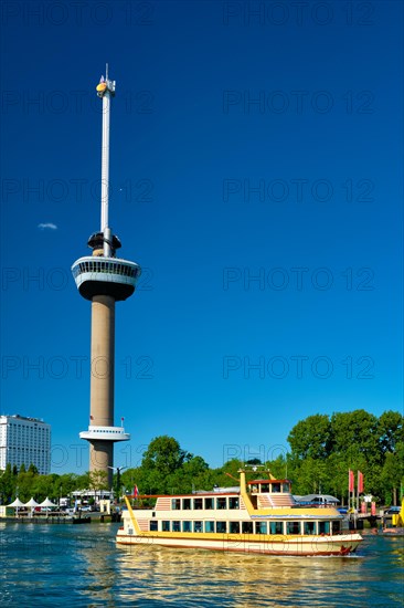 Rotterdam cityscape with Euromast observation tower and tourist boat on Nieuwe Maas river. Rotterdam