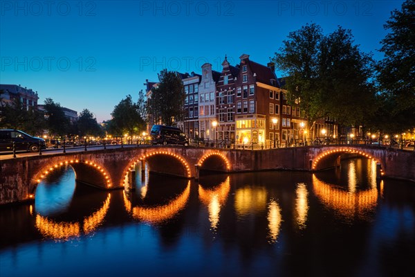 Night view of Amterdam cityscape with canal