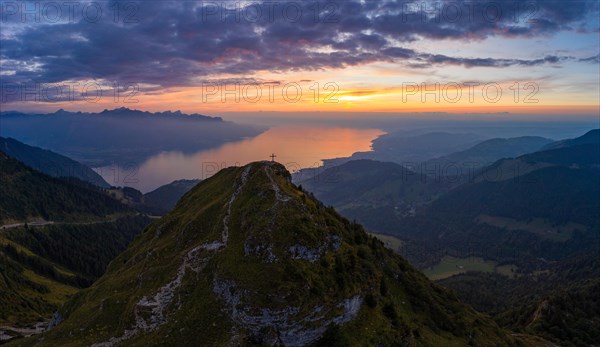 Aerial view of Dent de Jaman with the summit cross and Lake Geneva in the background after sunset