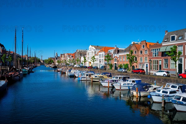 View of the harbour with moored boats in Delfshaven district