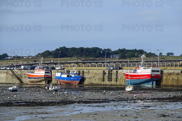 Fishing boat in Roscoff harbour at low tide